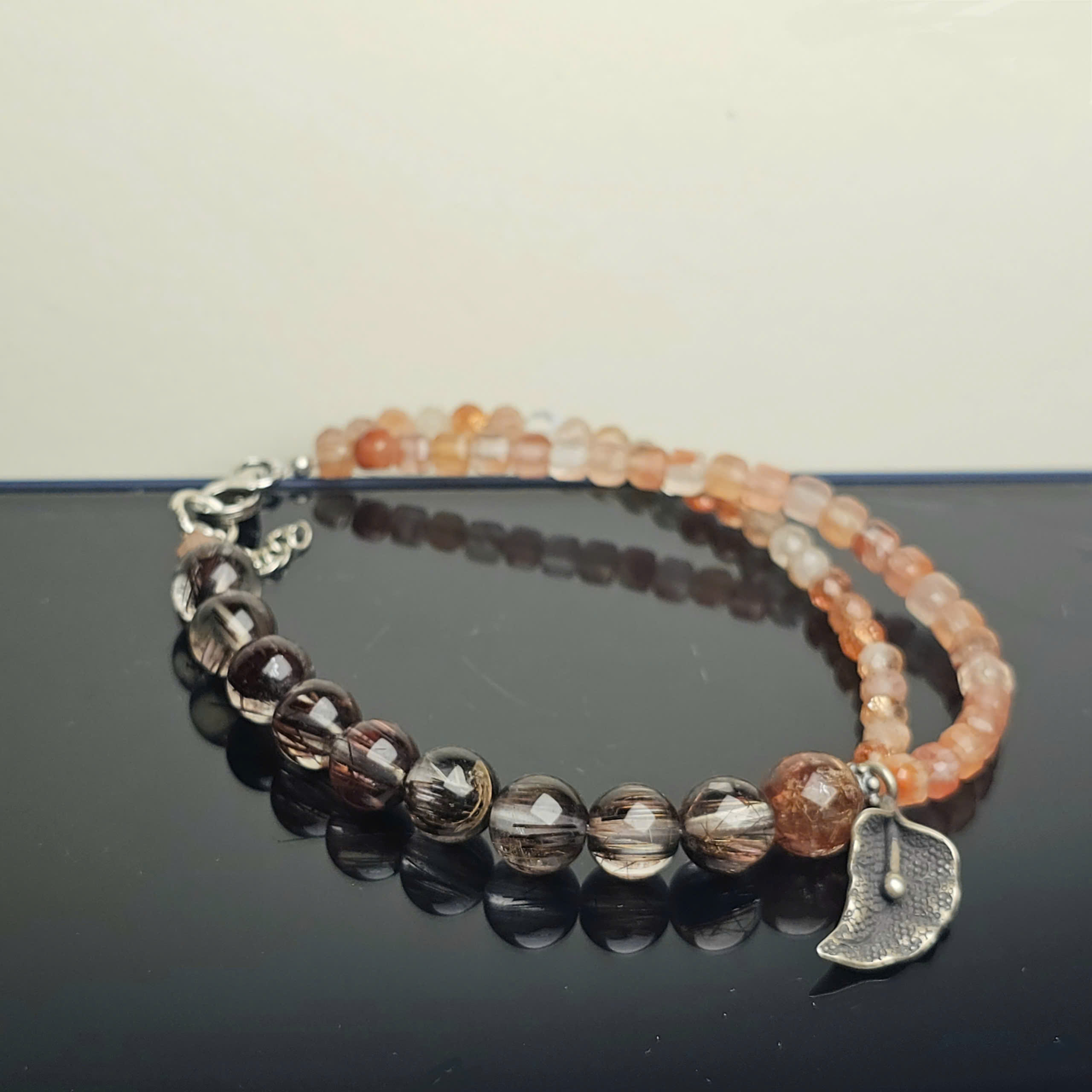 Vòng tóc nâu đỏ mix Sunstone, charm lá bạc 925